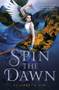 Spin the Dawn by Elizabeth Lim cover shows a girl holding magic scissors and a bolt of fabric with a hawk behind her