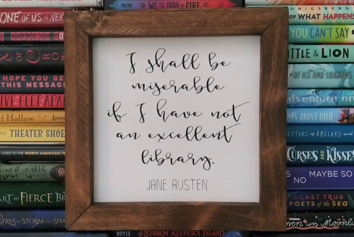 "I shall be miserable if I have not an excellent library." - Jane Austen quote in wood frame