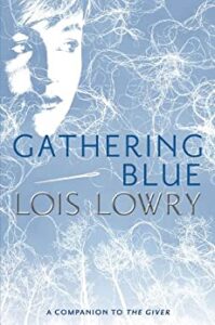 Gathering Blue by Lois Lowry cover shows a girl's face in the top left corner and silhouettes of trees across the bottom. Unspooled threads are scattered across the whole cover.