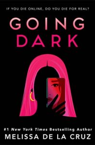 Going Dark by Melissa de la Cruz cover shows a girl facing the camera, her face dark. She holds up a photograph of a girl's face partly over hers.