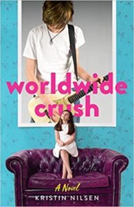 Worldwide Crush Kristin Nilsen cover shows a girl sitting on the back of a leather couch looking up. Behind her is a giant poster of a boy with a guitar.